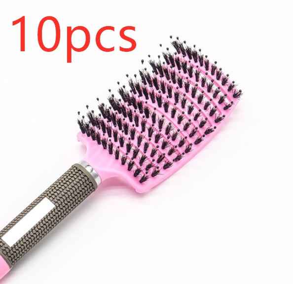 Cepillo de pelo profesional de color rosa con mango ergonómico antideslizante.