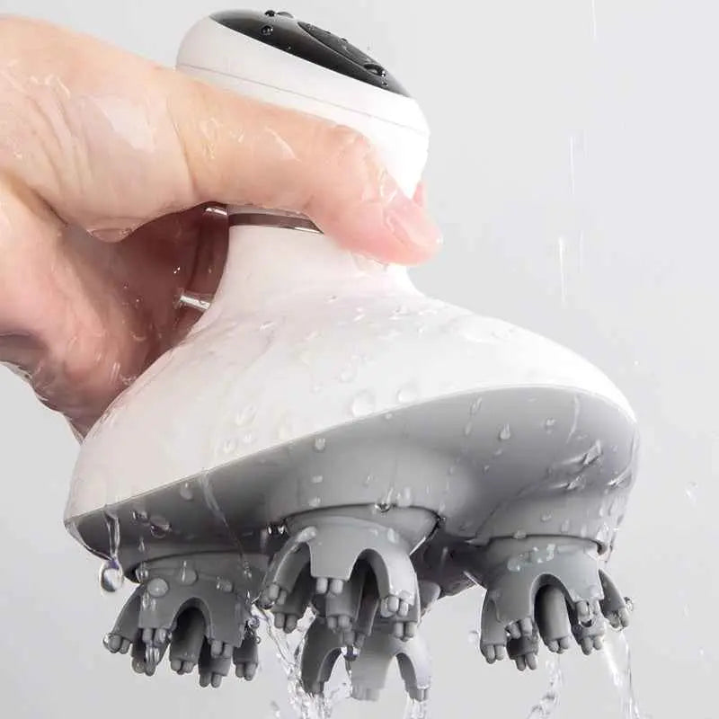 Masajeador capilar eléctrico de silicona con cabezales rotatorios para cuero cabelludo.