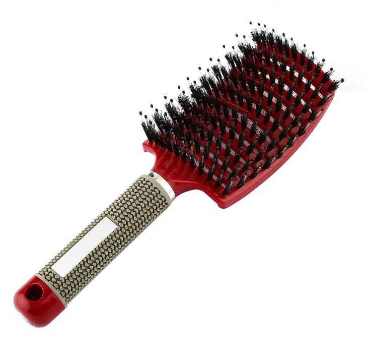 Cepillo de pelo profesional con mango ergonómico antideslizante y cerdas negras.