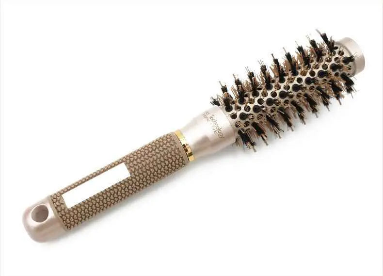 Cepillo térmico redondo para peinado y secado de cabello en color oro rosa.