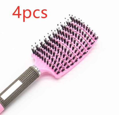 Set de 4 cepillos para el cabello de color rosa con mango ergonómico antideslizante.