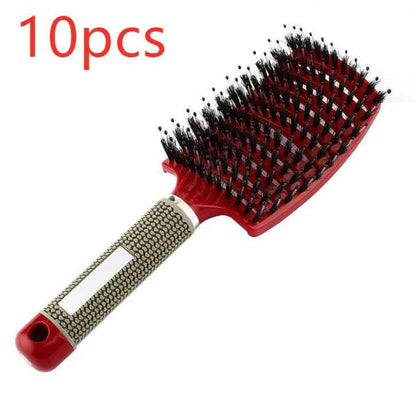Cepillo de pelo profesional con mango ergonómico y cerdas negras sobre fondo blanco.