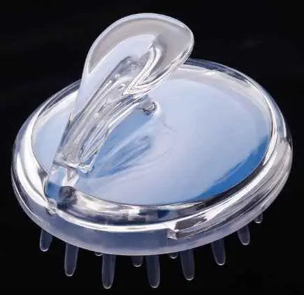 Masajeador de cuero cabelludo de silicona azul para limpieza y relajación.